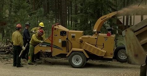 United Way of Missoula partnered with the Frenchtown Rural Fire Department to help residents near Frenchtown and Huson prepare for wildfires as part of a pilot project. Including offering a chipper for debris removed from around homes. (Photo courtesy of Frenchtown Rural Fire Department)