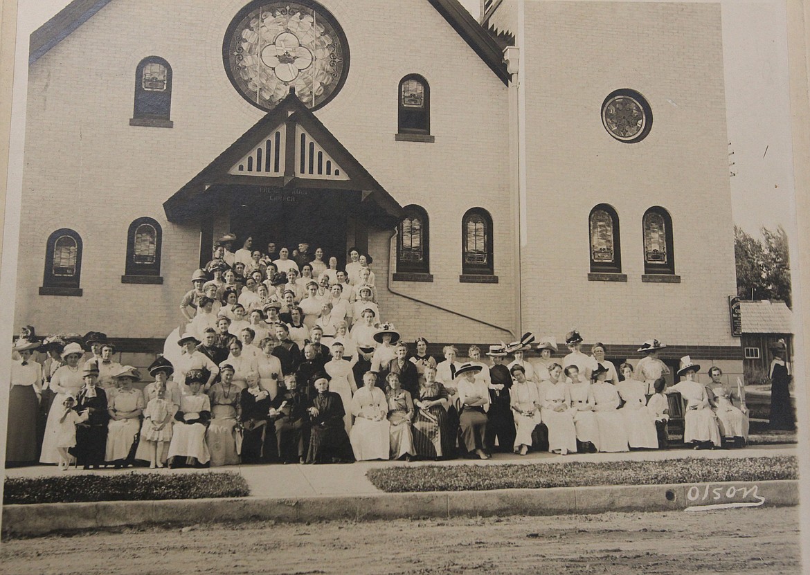 This 1912 photo in front of First Presbyterian in Coeur d'Alene shows the women of the Ladies Aid Society, which was formed &quot;to devise ways and means to complete and furnish the church.&quot; Anna Warner, wife of Coeur d'Alene's first mayor, &quot;Major&quot; C.D. Warner, was the first president of this group. First Presbyterian keeps this photo in a frame in a special place with other historic items and photos. (Courtesy photo)