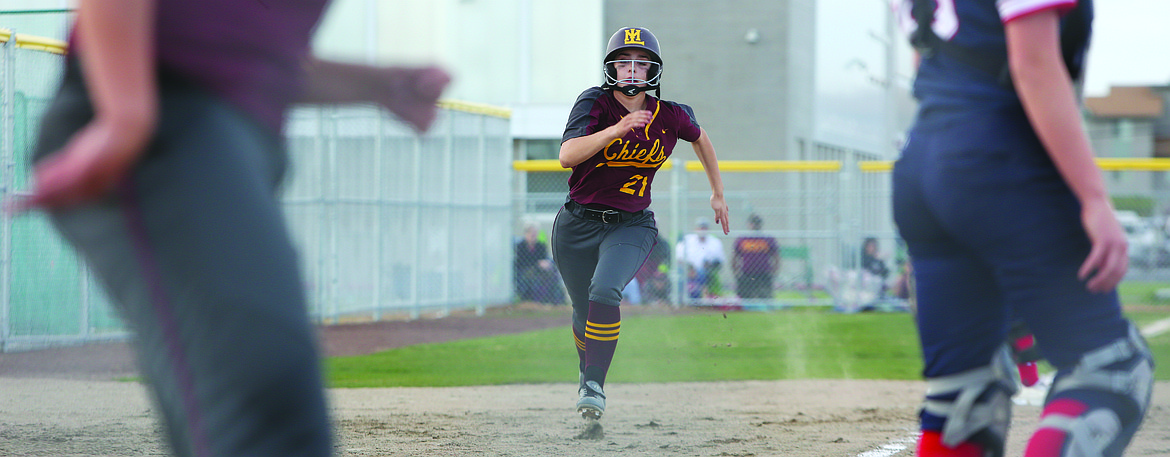 Connor Vanderweyst/Columbia Basin Herald
Moses Lake pinch-runner Ciarrah Knoll rounds third and comes in to score on a 2-run single by Michelle Turner in the second inning.