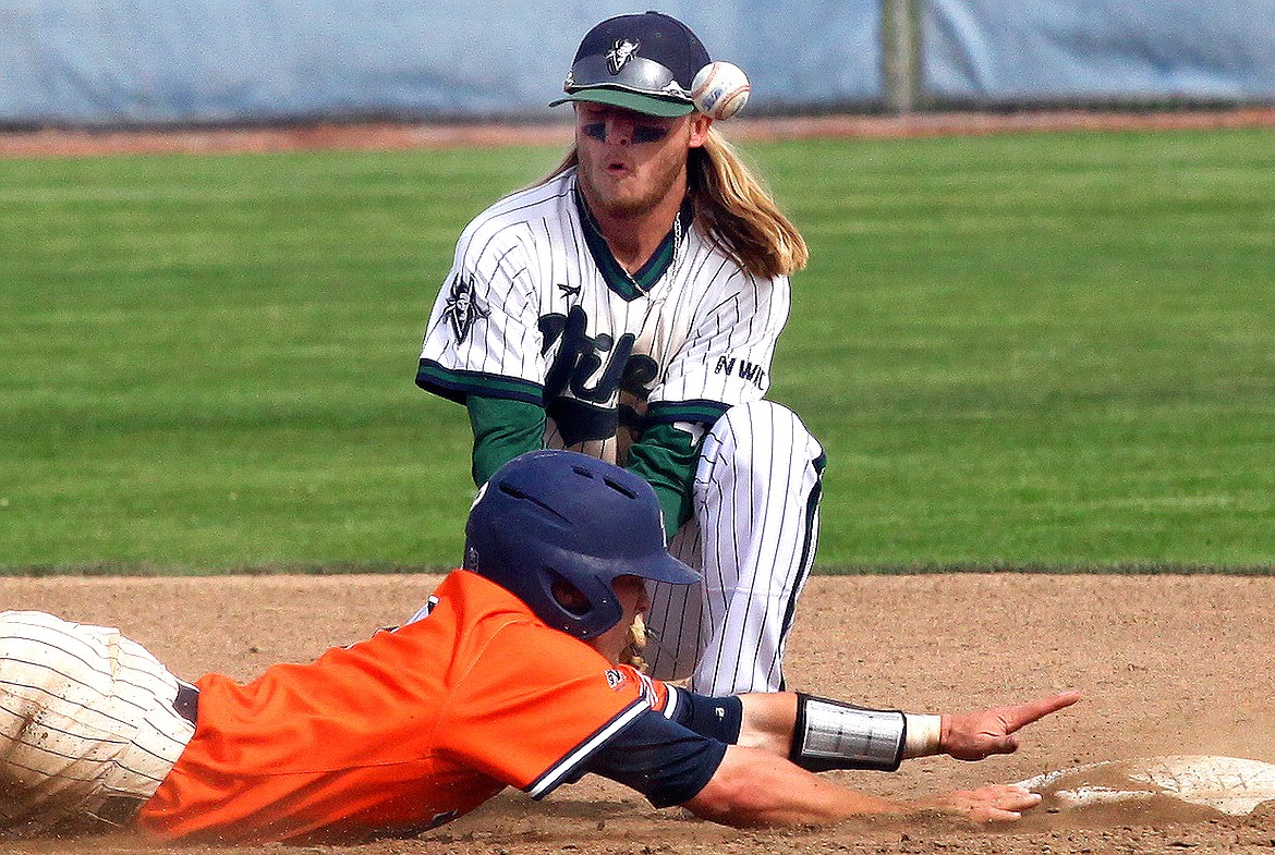 Rodney Harwood/Columbia Basin Herald
Big Bend shortstop Kyle Tolf tries to get the handle on a pick-off throw down to second base from catcher Dylan Miller during the second game of Saturday's NWAC East doubleheader with Treasure Valley.