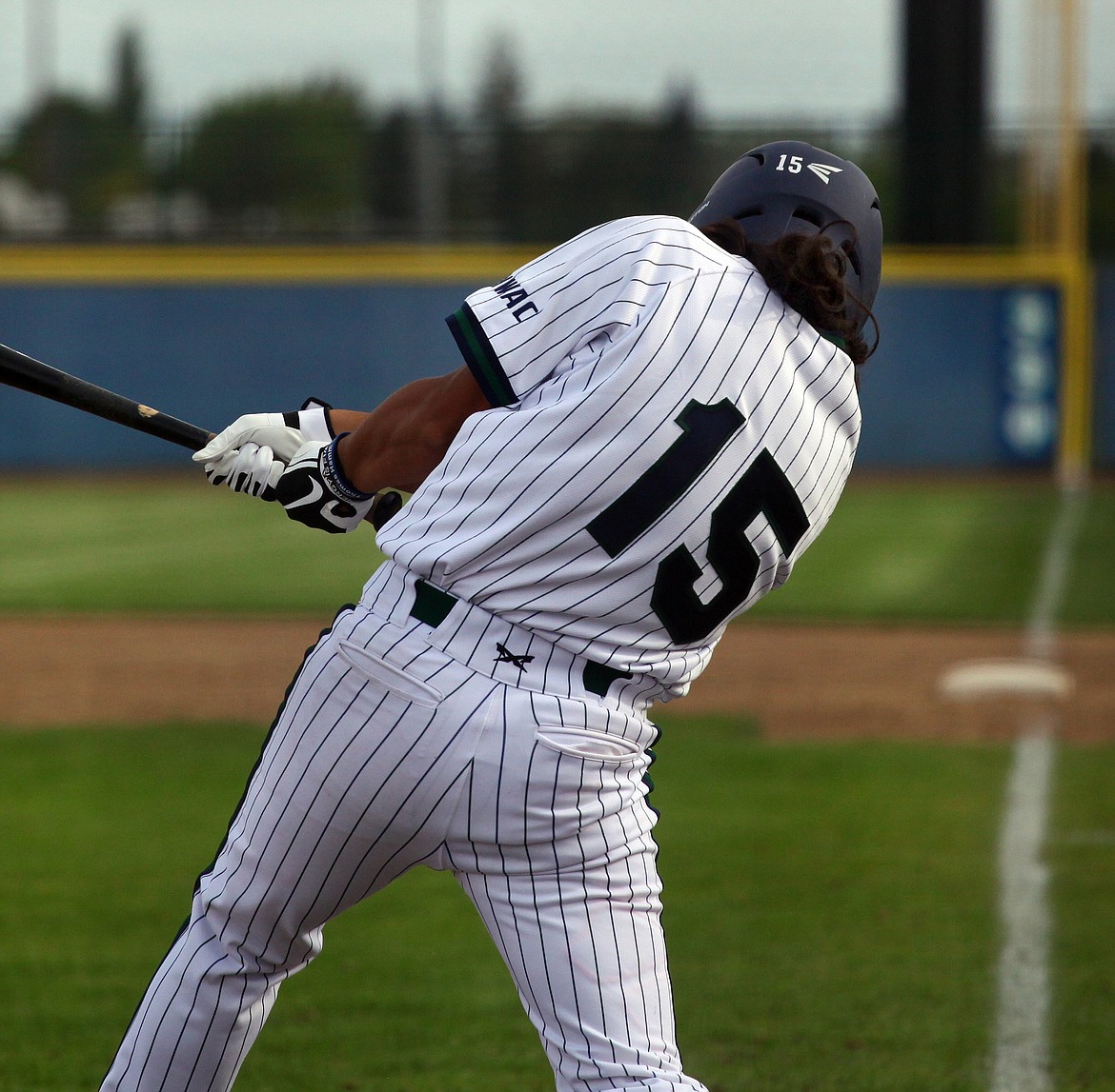 Rodney Harwood/Columbia Basin Herald
Big Bend pinch-hitter Daniel Ochoa of Moses Lake drives an RBI-single back up the middle in Saturday's NWAC East doubleheader with Treasure Valley.