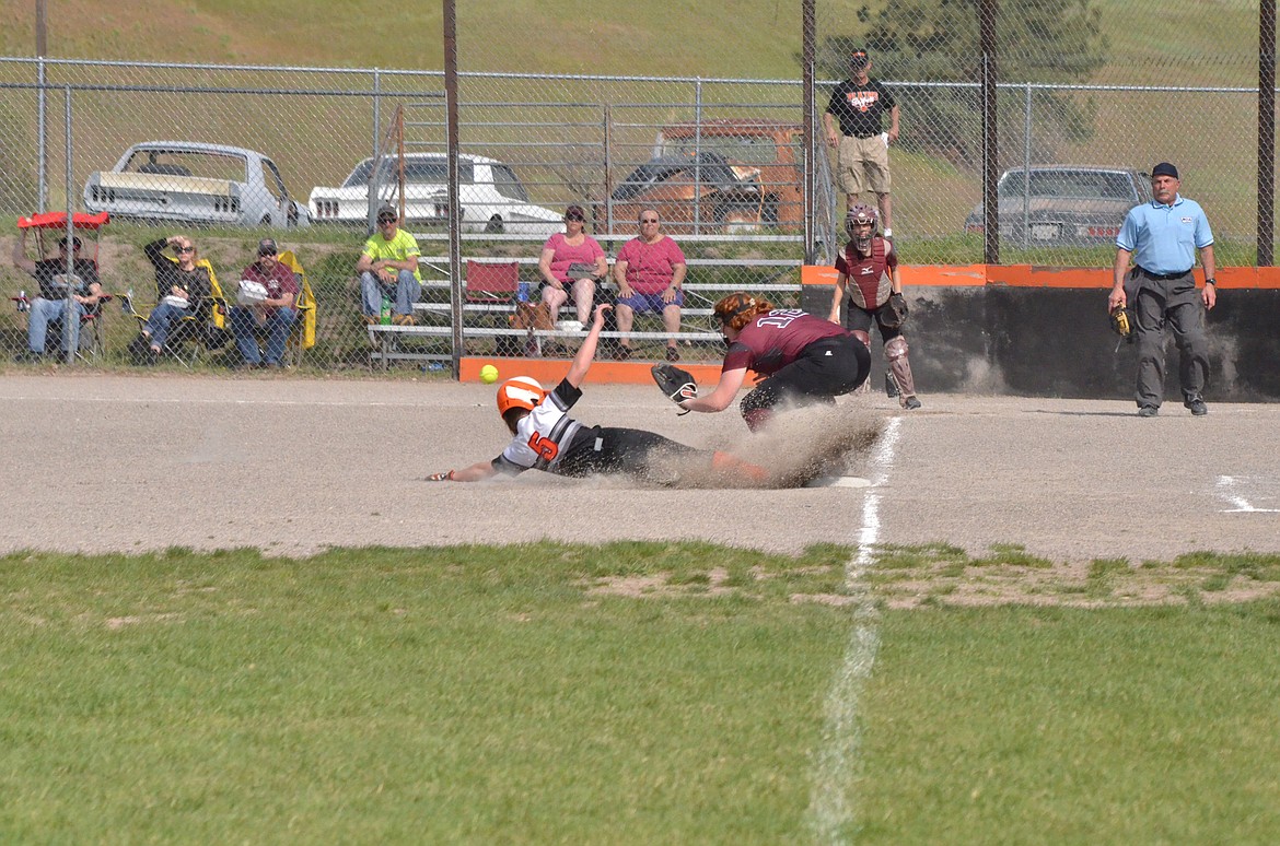 Trotter Skylar Bergstrom slides safely into third. (Erin Jusseaume/ Clark Fork Valley Press)