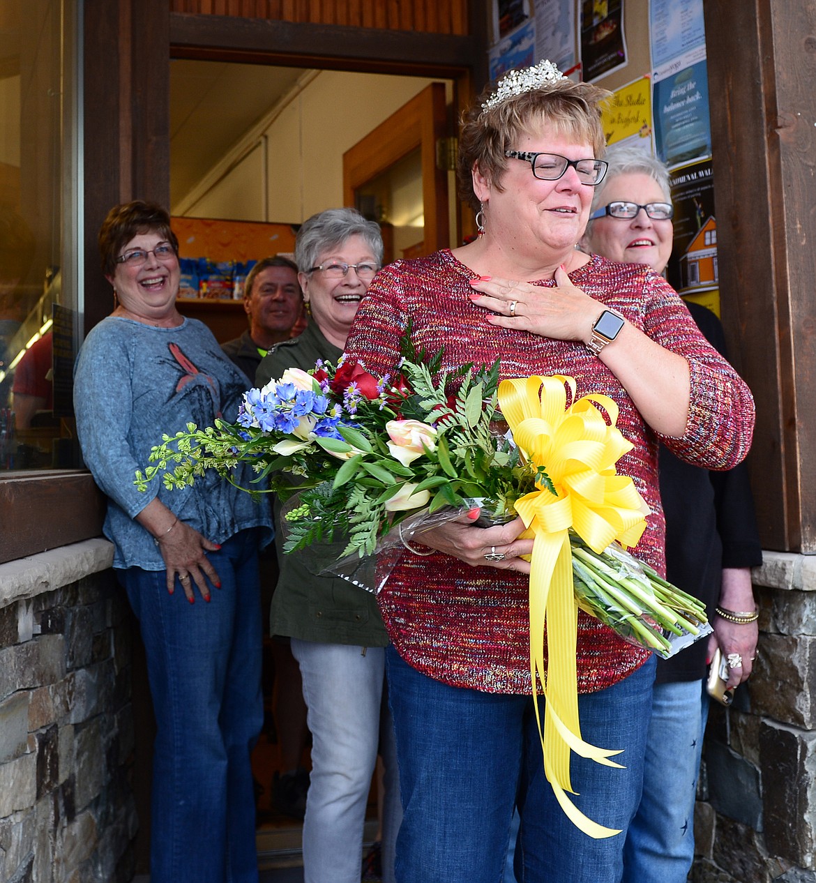 Donna Lawson, right, is surprised with a parade outside The Jug Tree in downtown Bigfork.