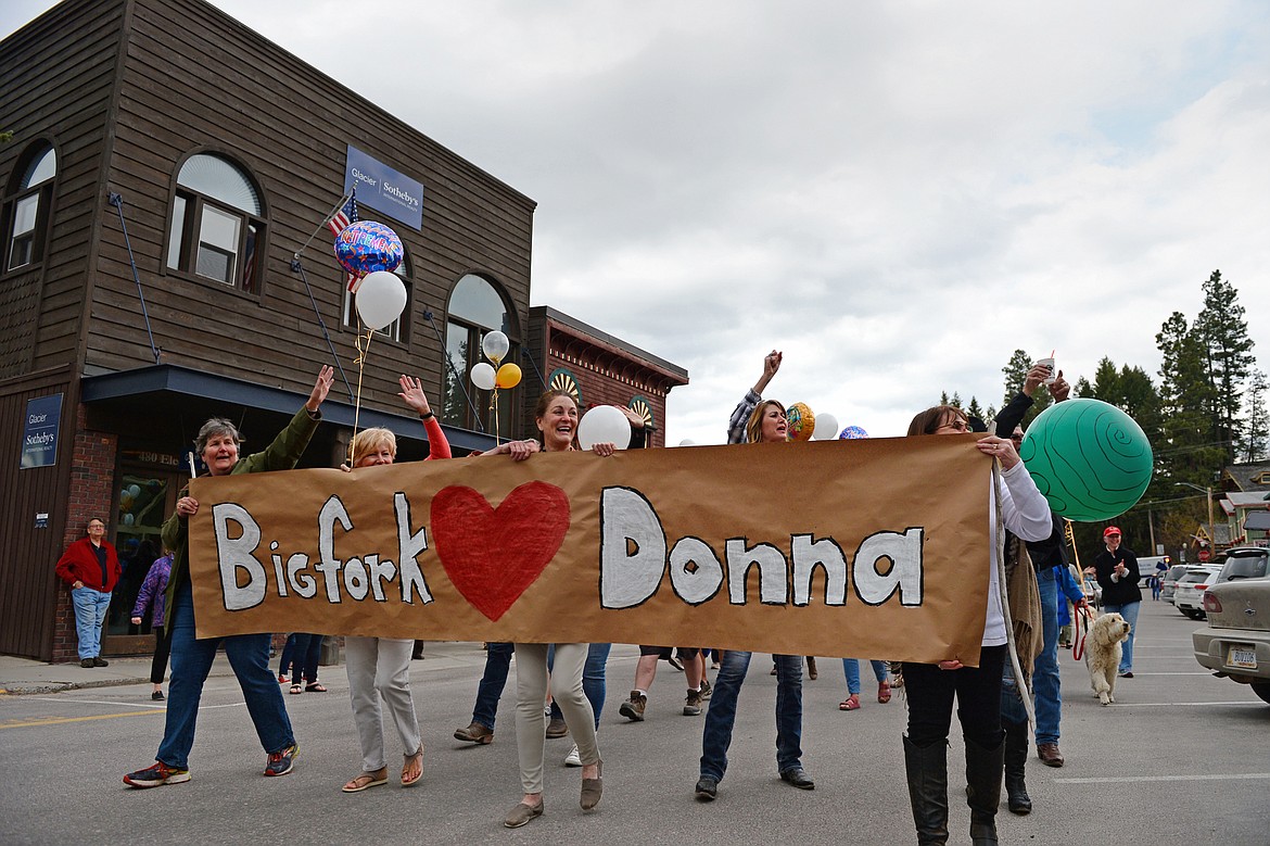 A parade for Donna Lawson proceeds down Electric Avenue in Bigfork.