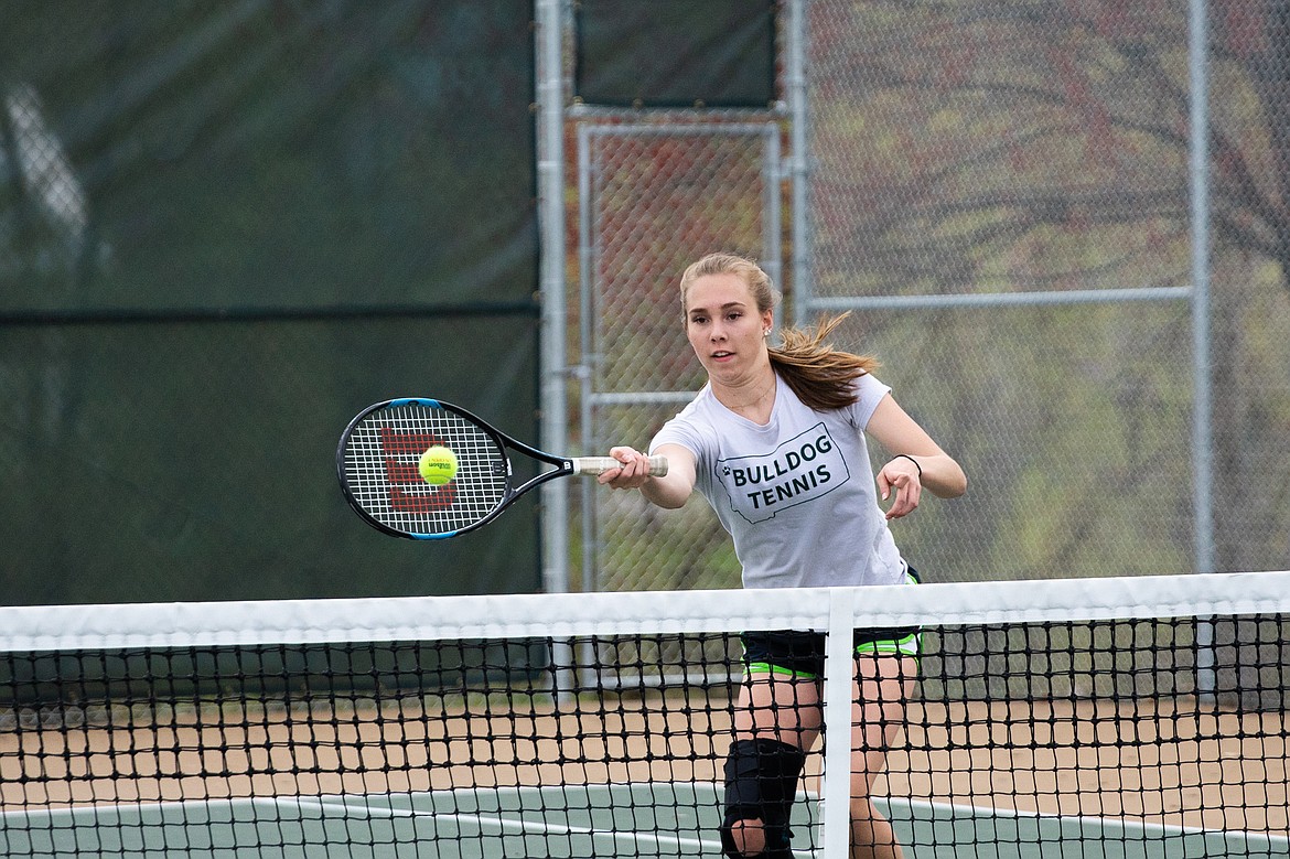 Kit Anderson reaches out near the net in a doubles match against Columbia Falls last Thursday.