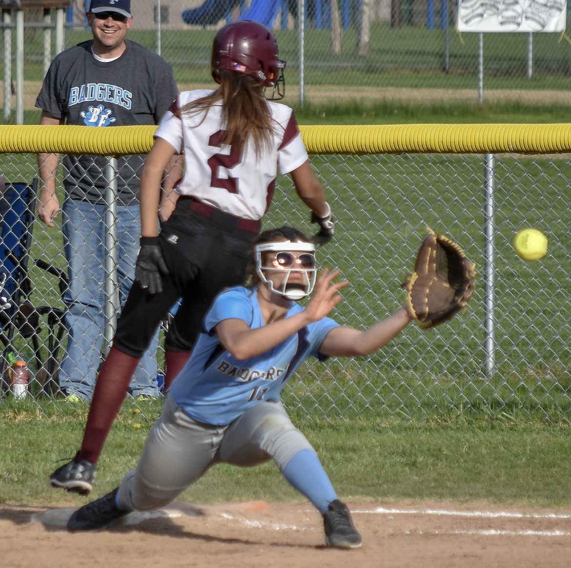 Fresman Talise Becquart makes it to first base on a single just barely ahead of the ball during Troy&#146;s 23-30 loss to Bonners Ferry Thursday. (Benjamin Kibbey/The Western News)