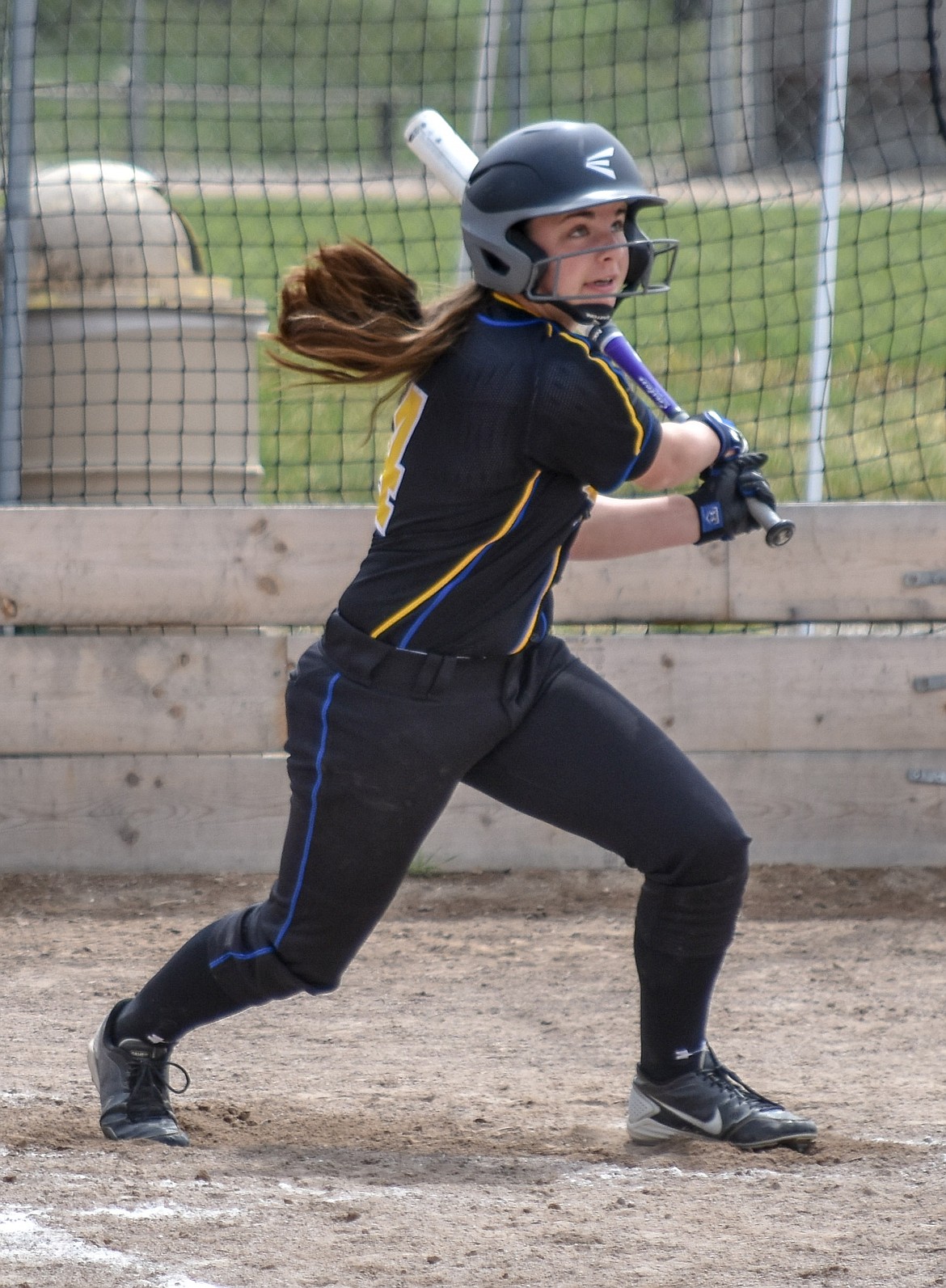 Freshman Bethany Thomas singles on a line drive to center field, batting in sophomore Keira Ward during Libby&#146;s 23-0 win against Browning Saturday.