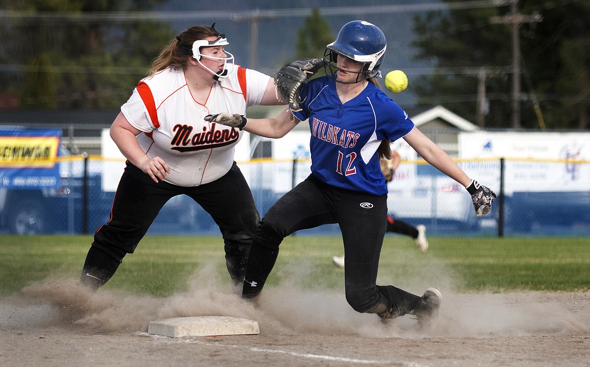 Kaylee Ashe reaches third base as Ronan&#146;s Marissa Mock reaches for the ball during action in Columbia Falls Thursday. (Jeremy Weber photo)