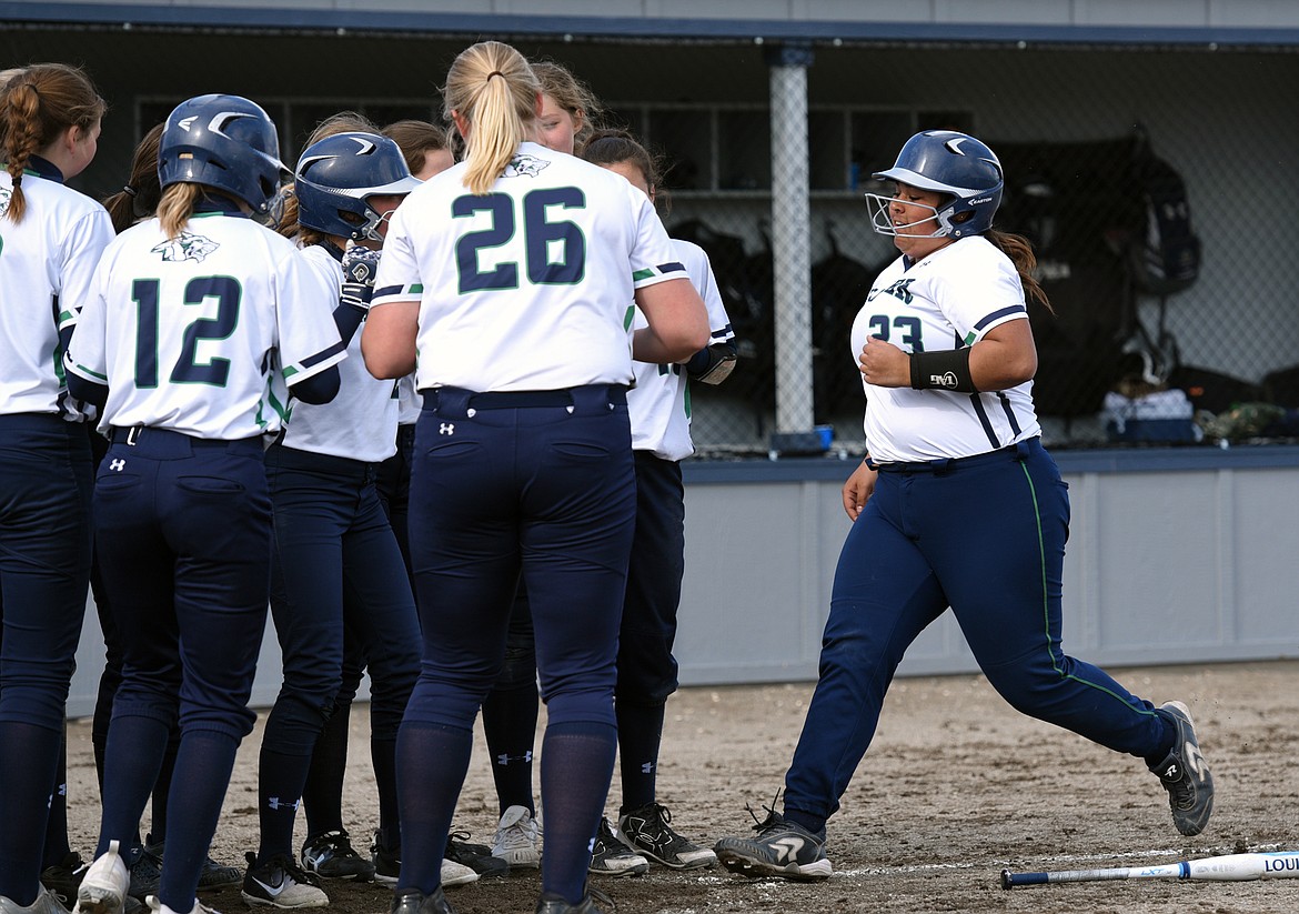 Glacier's Sage Vanterpool is congratulated by teammates after a solo home run in the bottom of the second inning against Polson. (Casey Kreider/Daily Inter Lake)