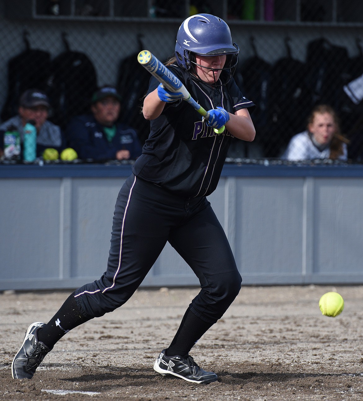 Polson's Marina Mayorga drops down a sacrifice bunt that scored a run in the top of the third against Glacier. (Casey Kreider/Daily Inter Lake)