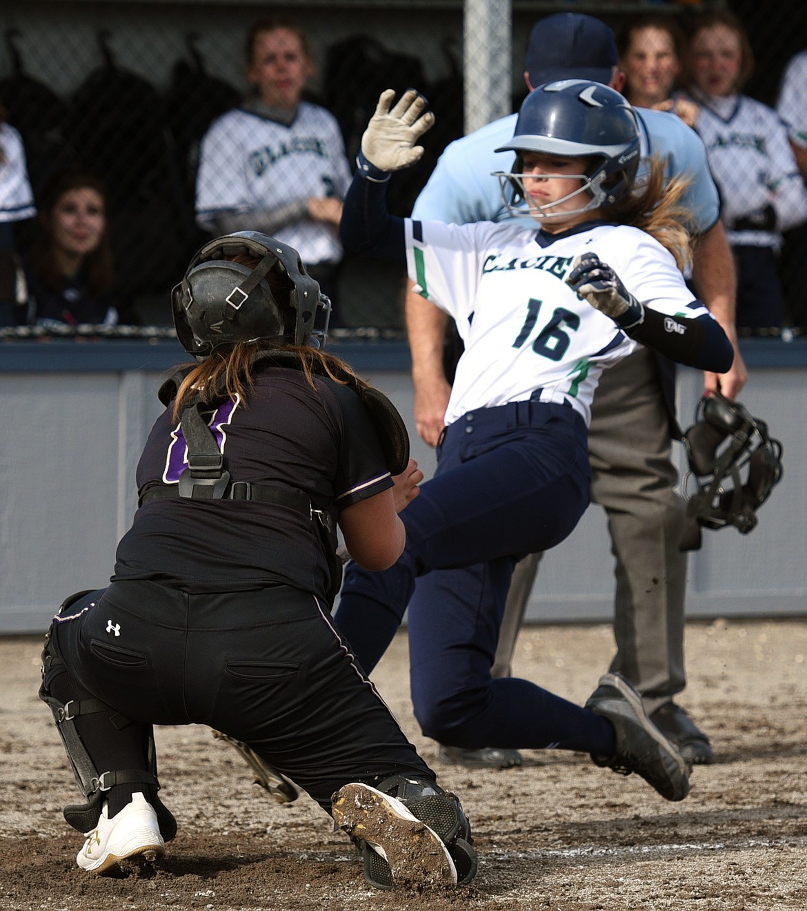 Glacier's Addie Labrum is tagged out at the plate by Polson catcher Kaylanna DesJarlais in the bottom of the second inning. (Casey Kreider/Daily Inter Lake)