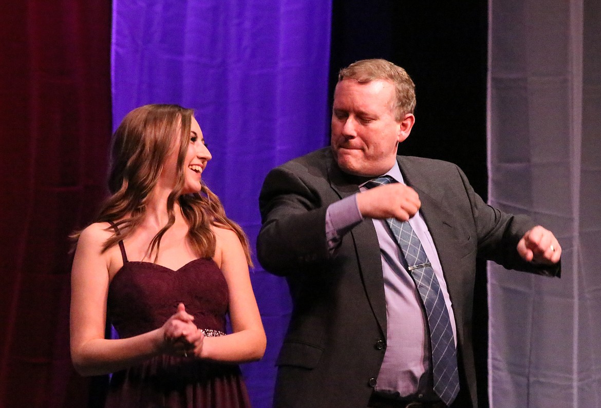 Photo by MANDI BATEMAN
Lindsey Christopherson and her father, Stan Christopherson, take a moment to have fun while he escorted her to the srage.