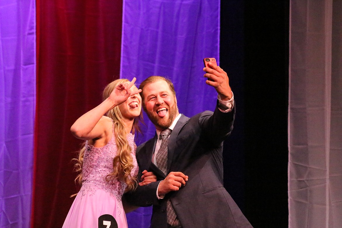 Photo by MANDI BATEMAN
Jerzie Pluid, first runner-up, and her father Justin Pluid, pause to take a selfie on stage.