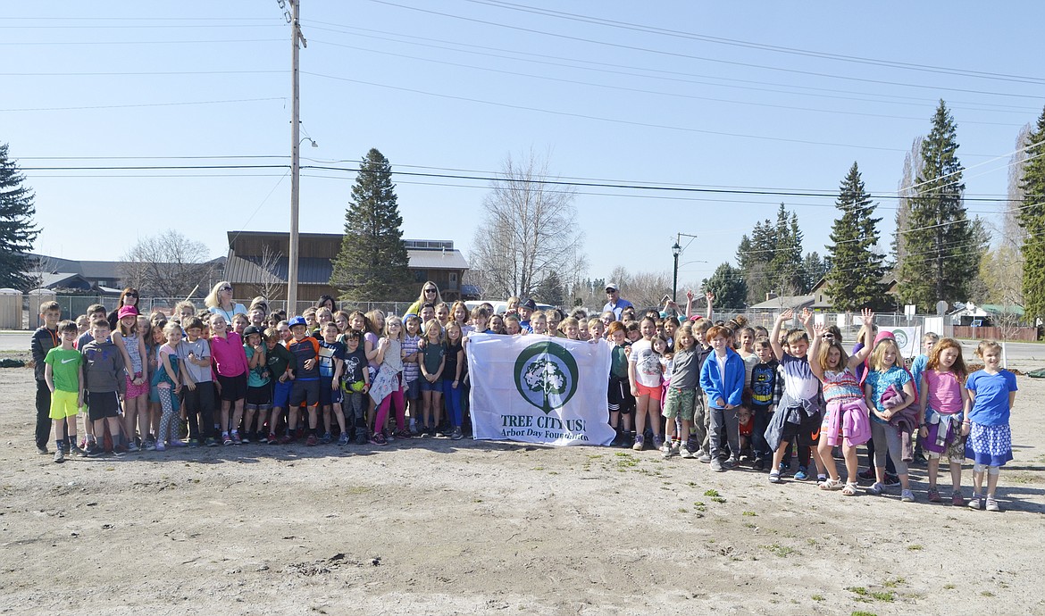 Muldown Elementary second-graders gather for a photo on Friday before planting three trees in Memorial Park in honor of Arbor Day. (Heidi Desch/Whitefish Pilot)