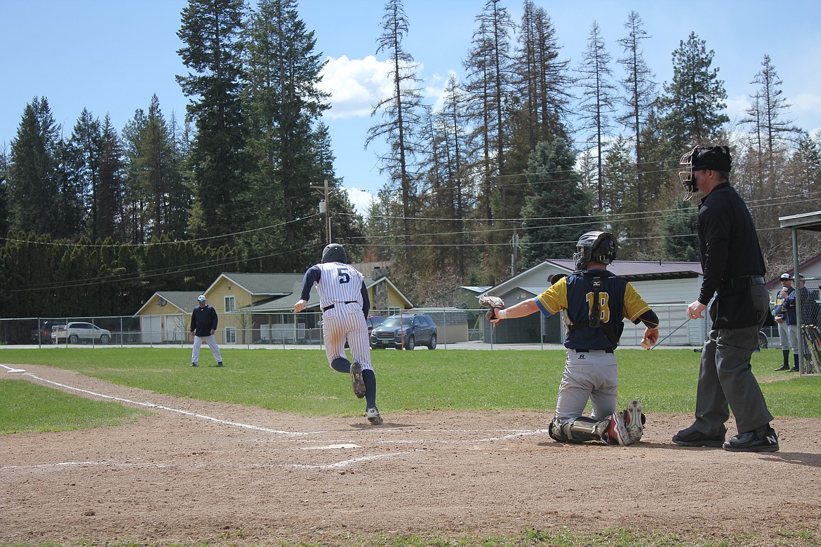 Seth Bateman races to first base during the Badgers&#146; April 21 doubleheader against the visiting Timberlake Tigers.