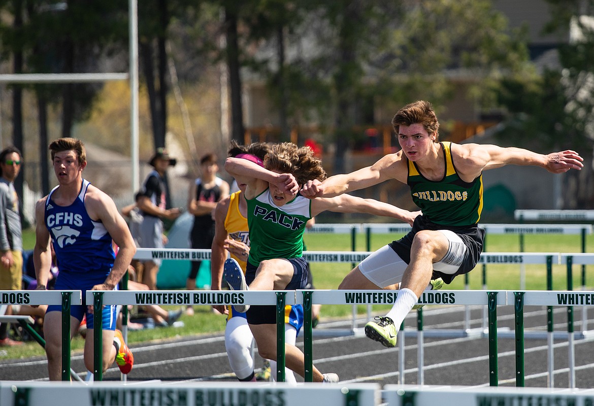 Lee Walburn races to a first-place finish in the 110 hurdles at the A.R.M. Invitational Saturday at Whitefish High School. (Daniel McKay photos/Whitefish Pilot)