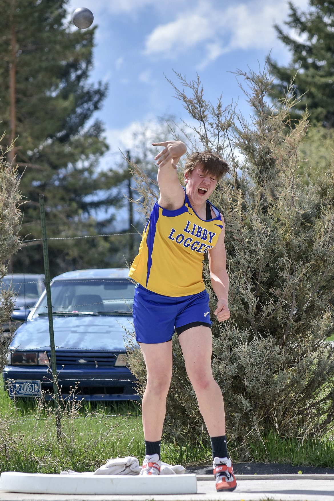 Libby senior Shannon Reny launches a 38 foot 8.25 inch shot put throw, setting a new school record, at the Lincoln County Track Meet Tuesday. (Benjamin Kibbey/The Western News)