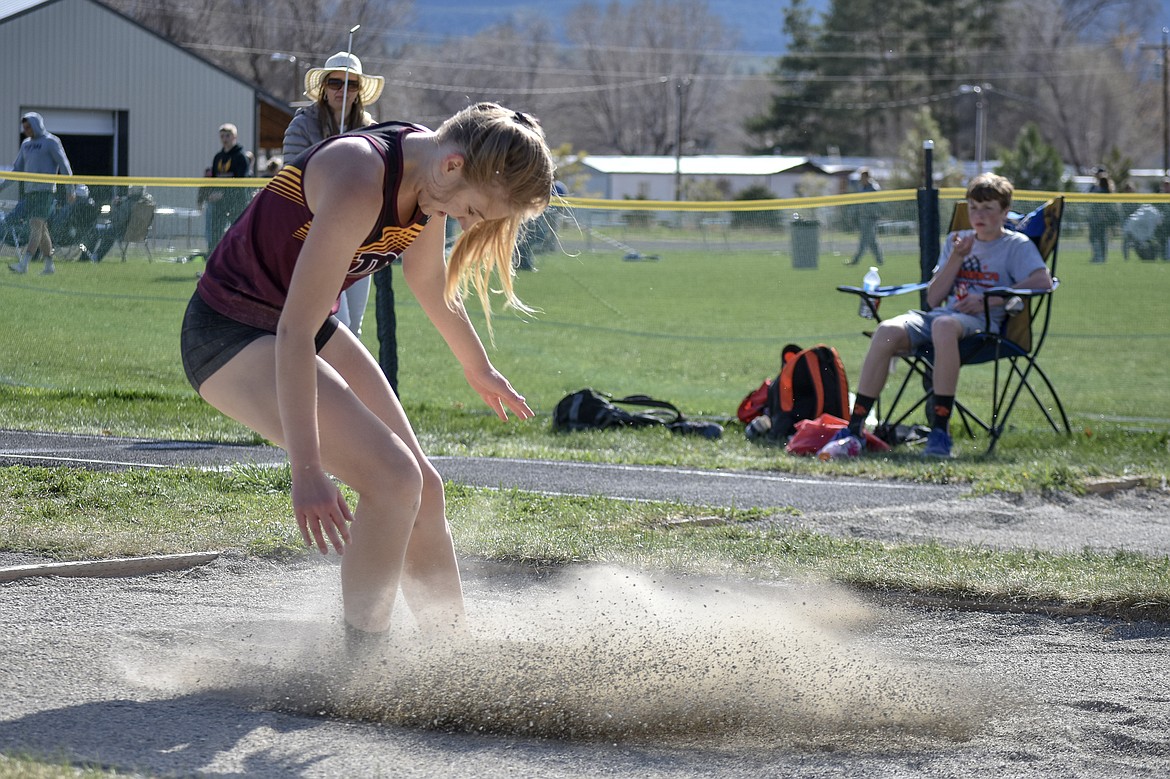 Troy sophomore Ella Pierce competes in the long jump at the Lincoln County Track Meet Tuesday.  (Benjamin Kibbey/The Western News)