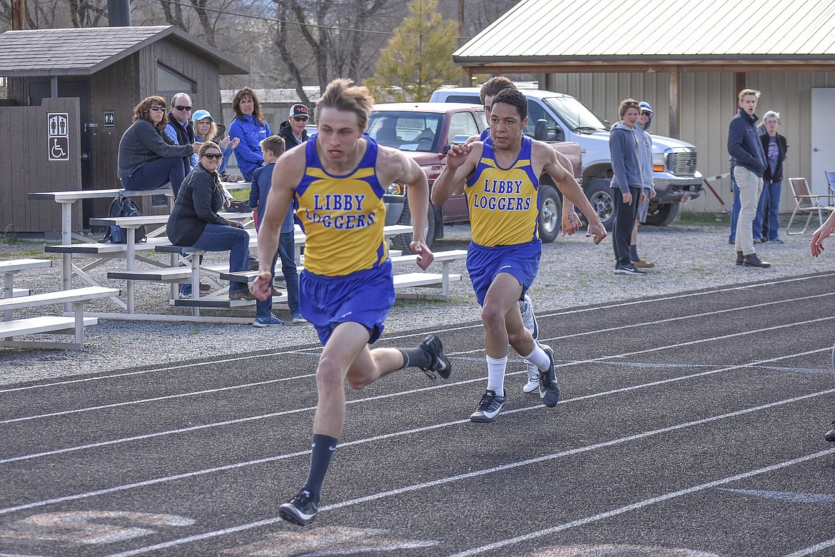 Libby senior Gavin Strom wins the 100m dash in 11.94 seconds with junior Eli Smith close behind at 12.37 seconds during the Lincoln County Track Meet Tuesday. (Benjamin Kibbey/The Western News)