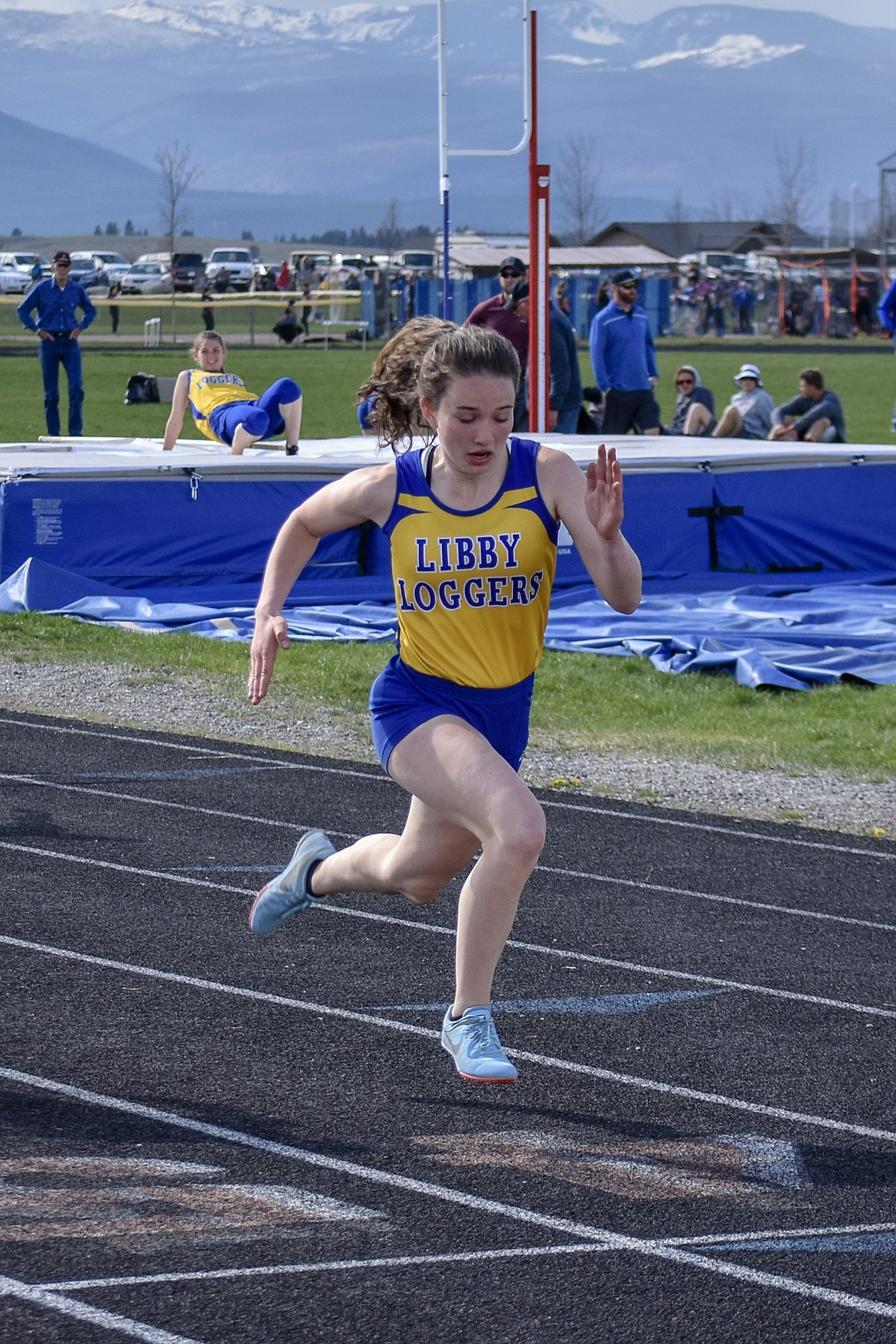 Libby junior Emma Gruber crosses the finish line after winning the 100m hurdles in 17.29 seconds at the Lincoln County Track Meet Tuesday. (Benjamin Kibbey/The Western News)