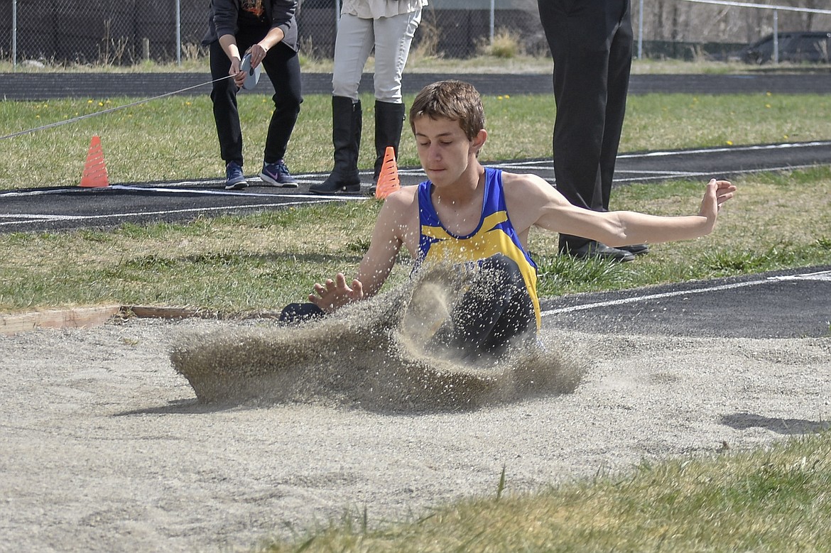 Libby freshman Keilan Rausch competes in the long jump at the Lincoln County Track Meet Tuesday. (Benjamin Kibbey/The Western News)