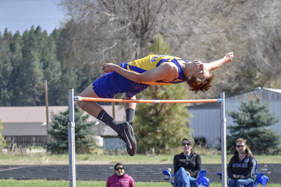 Libby senior Gavin Strom competes in the high jump at the Lincoln County Track Meet Tuesday. Strom won the event with a 6 foot jump.  (Benjamin Kibbey/The Western News)