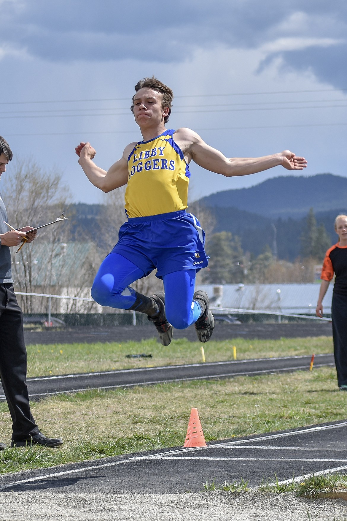 Libby junior Ethan Beck competes in the long jump at the Lincoln County Track Meet Tuesday. (Benjamin Kibbey/The Western News)