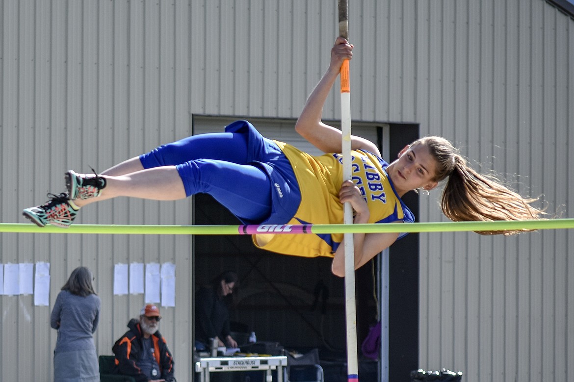 Libby freshman Halona LaFleur eyes the bar as she clears it during the pole vault at the Lincoln County Track Meet Tuesday. (Benjamin Kibbey/The Western News)