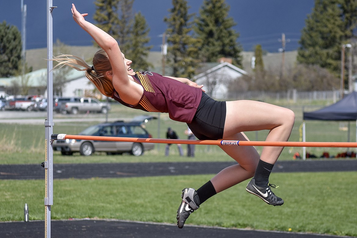 Troy sophomore Ella Pierce clears the bar at 4 feet 8 inches at the Lincoln County Track Meet Tuesday.  (Benjamin Kibbey/The Western News)