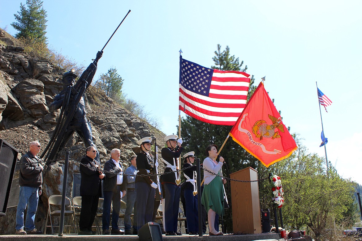 Members of the Kellogg High School JROTC present the colors during the singing of the national anthem by Nicole Delbridge.