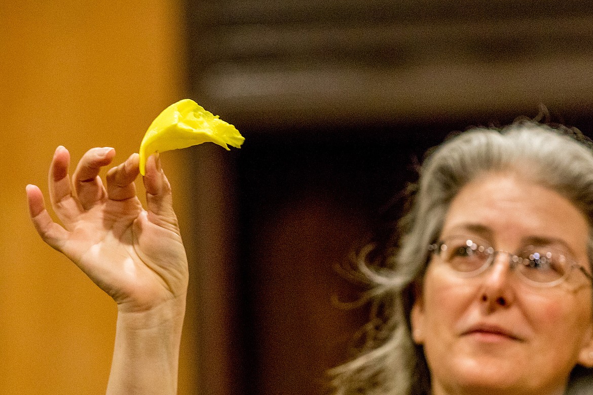 Susan James, park ranger at Libby Dam Visitor Center, displays a prosthetic bald eagle beak during a presentation by Birds of Prey Northwest on Saturday, April 28, 2018. The beak, printed by a three-dimensional printer, was designed to help rehabilitate Beauty, an injured bald eagle. &#147;Beauty and the Beak&#148; is the award-winning children&#146;s book about Beauty&#146;s experience. (John Blodgett/The Western News)