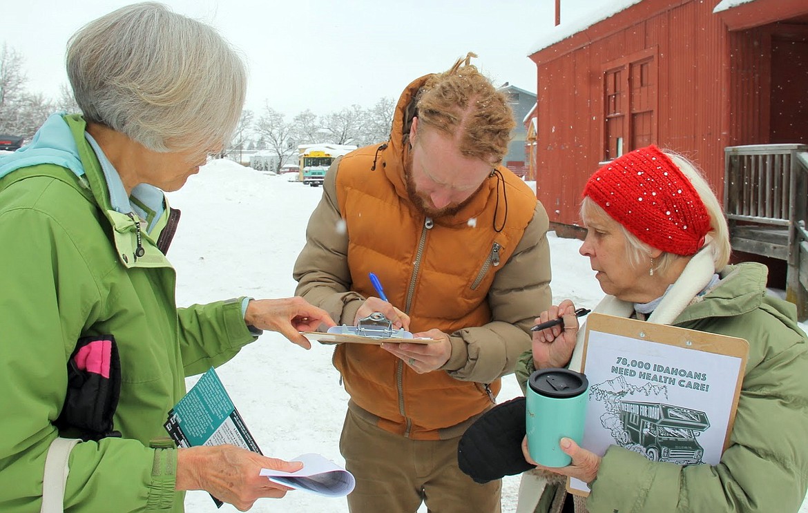 (Courtesy photo)
Bonner County volunteers get a signature as part of an effort to add Medicaid expansion onto the ballot. Reclaim Idaho officials announced Monday that they expected to file petitions with county clerks across the state Monday and today.