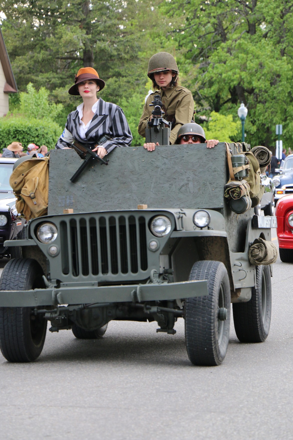 (Photo by CAROLINE LOBSINGER)Participants in the car parade make their way down Church Street.