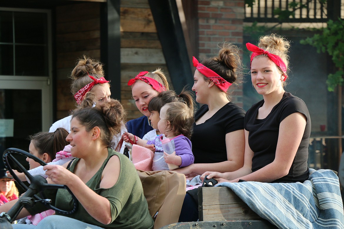 (Photo by CAROLINE LOBSINGER)Participants in  the Lost in the '50s classic car parade get dressed for the occasion.