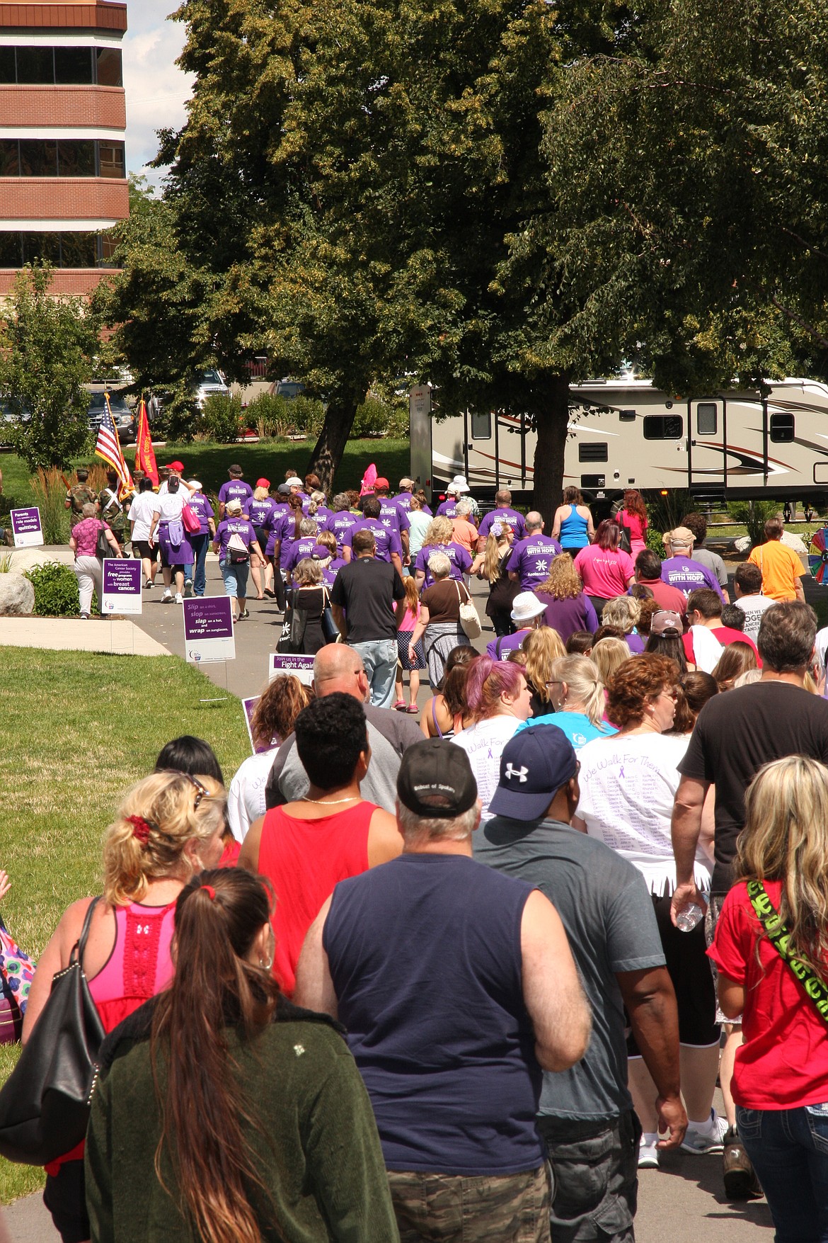 Hundreds of people walk laps around McEuen Park in Coeur d'Alene during the 2016 Relay for Life of Kootenai County. The next Relay begins at noon Saturday in Post Falls Middle School and will include plenty of activities, food, music and special ceremonies to celebrate cancer survivors and honor those who have passed. (Photo by Coeur d'Alene Creative Images Photography)