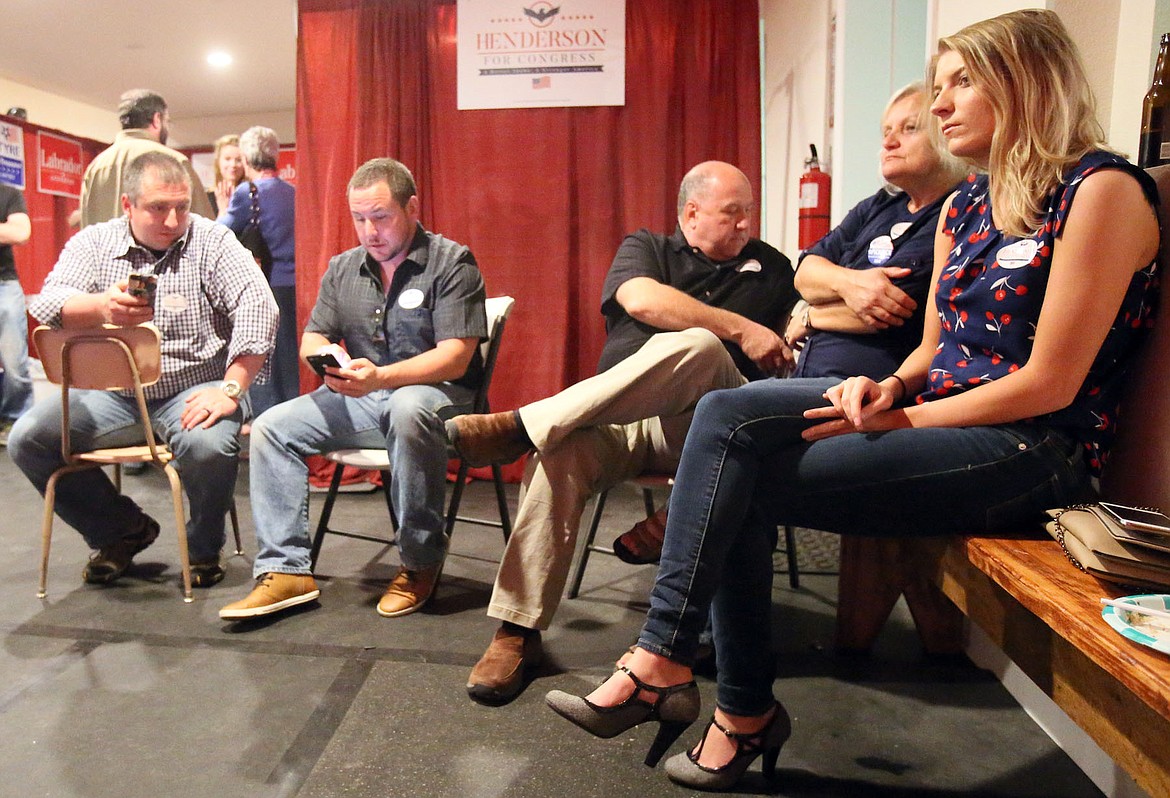 Republican congressional candidate Nick Henderson watched the election returns with his campaign team and family Tuesday night. (JUDD WILSON/Press)