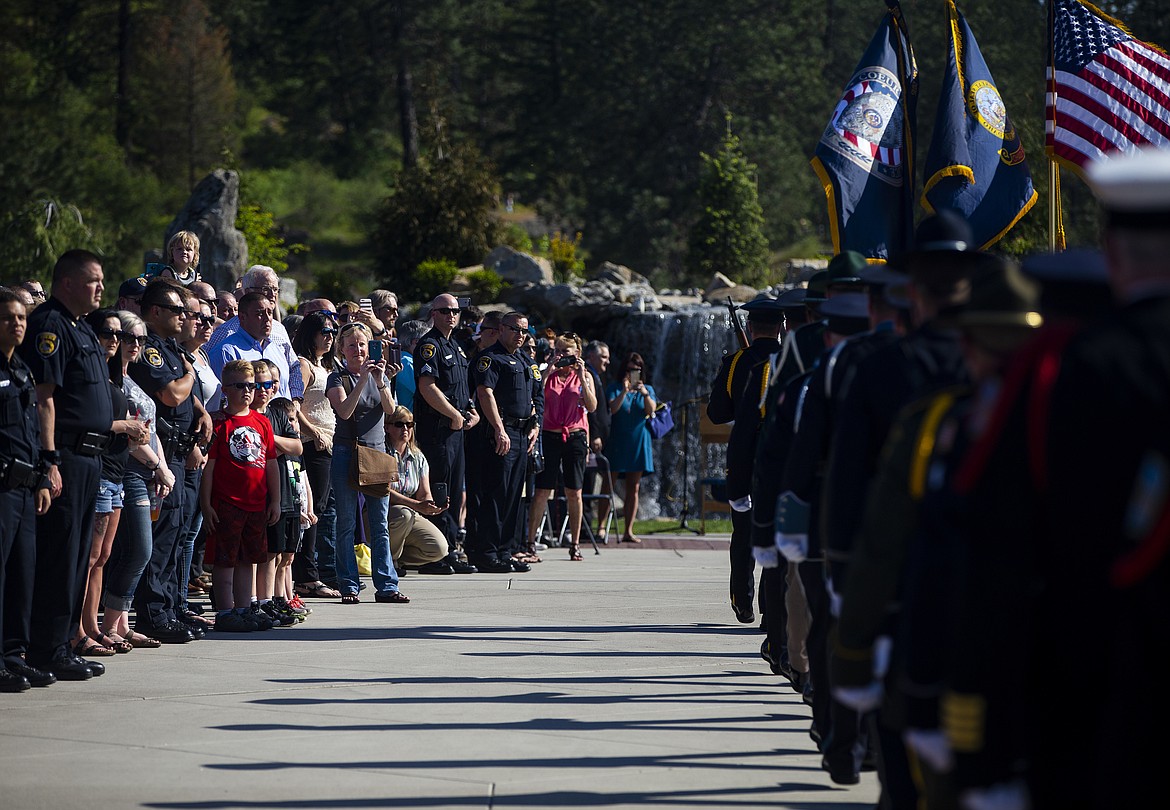 Hundreds gather to watch local law enforcement parade down to the k27 Forever Memorial to honor of Sgt. Greg Moore and other officers who have laid down their lives. (LOREN BENOIT/Press)