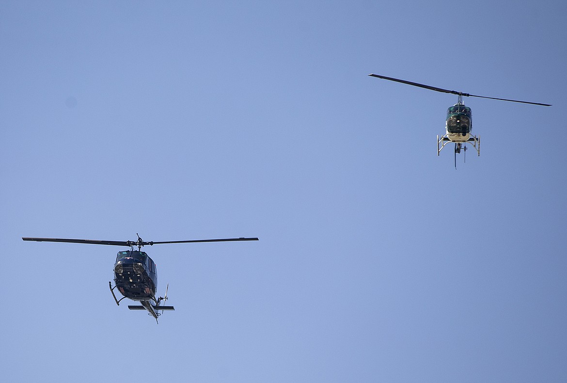 Law enforcement helicopters fly over during the K27 Forever Memorial dedication in honor of Sgt Greg Moore and other fallen police officers on Peace Officers Memorial Day. (LOREN BENOIT/Press)