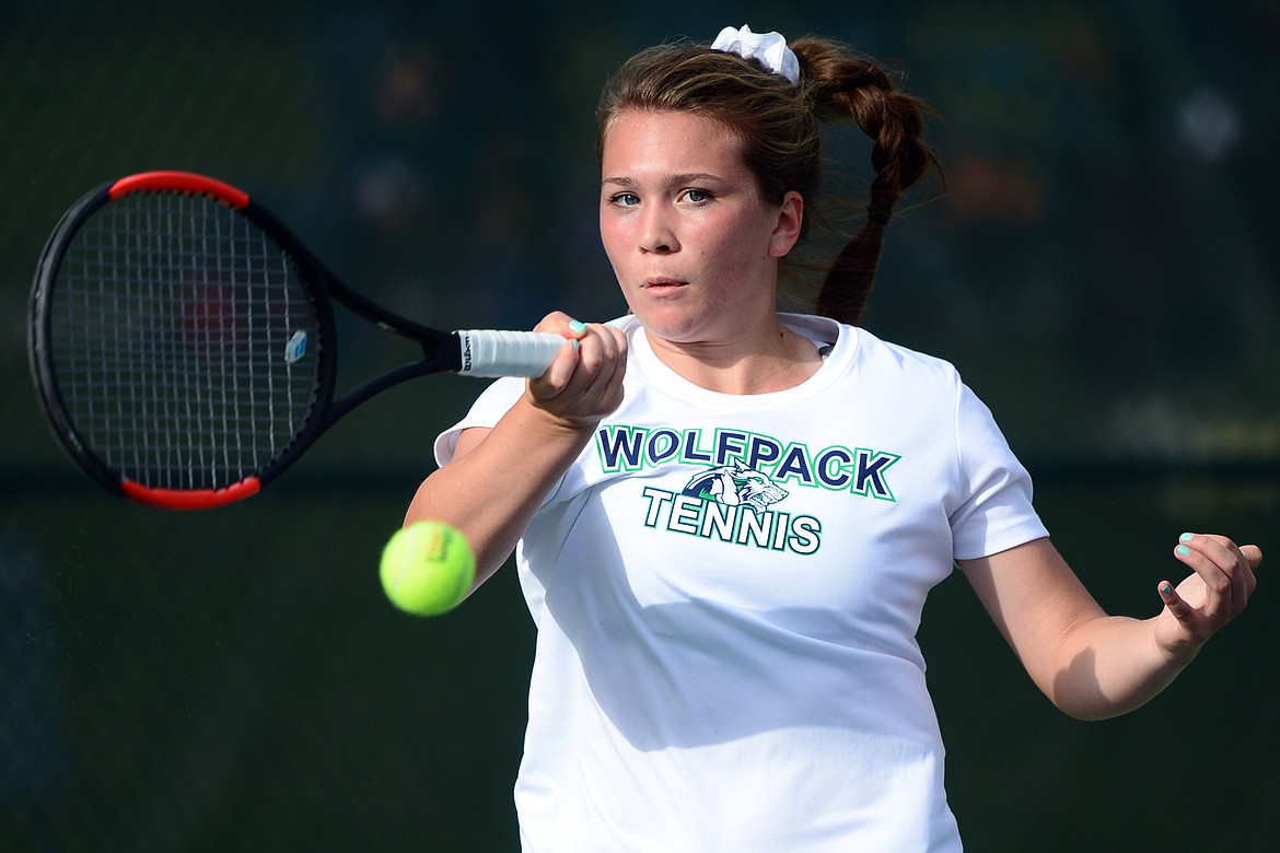 Glacier's Maria Frampton hits a return against Bozeman's Heather Sikoski in the Class AA State Tennis Tournament at Flathead Valley Community College in Kalispell on Friday. (Casey Kreider/Daily Inter Lake)