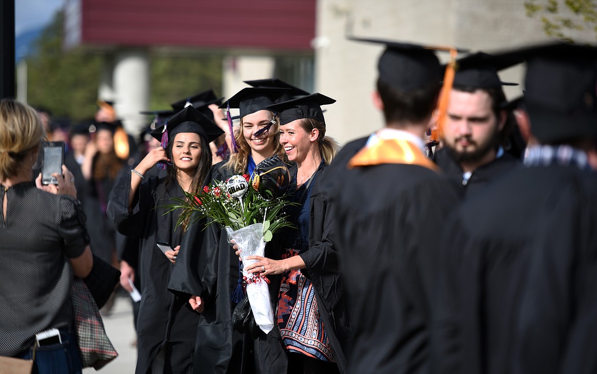 Flathead Valley Community College students gather for a photo as they wait for the start of the 50th Commencement Ceremony at Flathead Valley Community College on Friday, May 18, in Kalispell.(Brenda Ahearn/Daily Inter Lake)