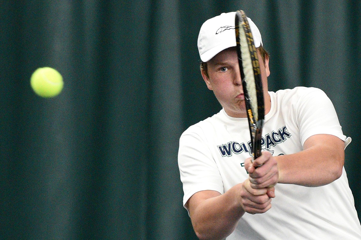 Glacier&#146;s Hunter Watterud hits a return in a doubles match against Helena&#146;s Alex Seburn and Evan Martin in the first round of the 2018 AA State Tennis Tournament in Kalispell on Thursday. Watterud&#146;s doubles partner was Morgan Cordell. (Casey Kreider/Daily Inter Lake)