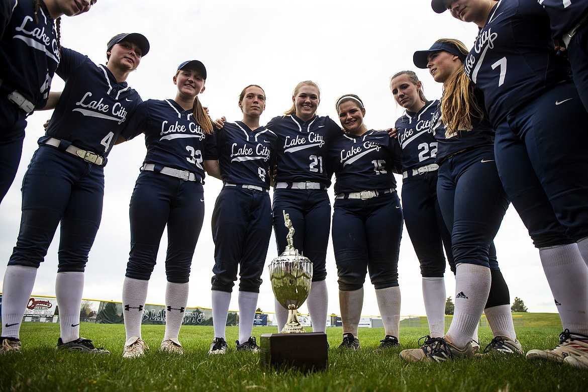 Lake City High softball players pose with the 5A Region 1 tournament championship trophy after beating Lewiston last Tuesday.