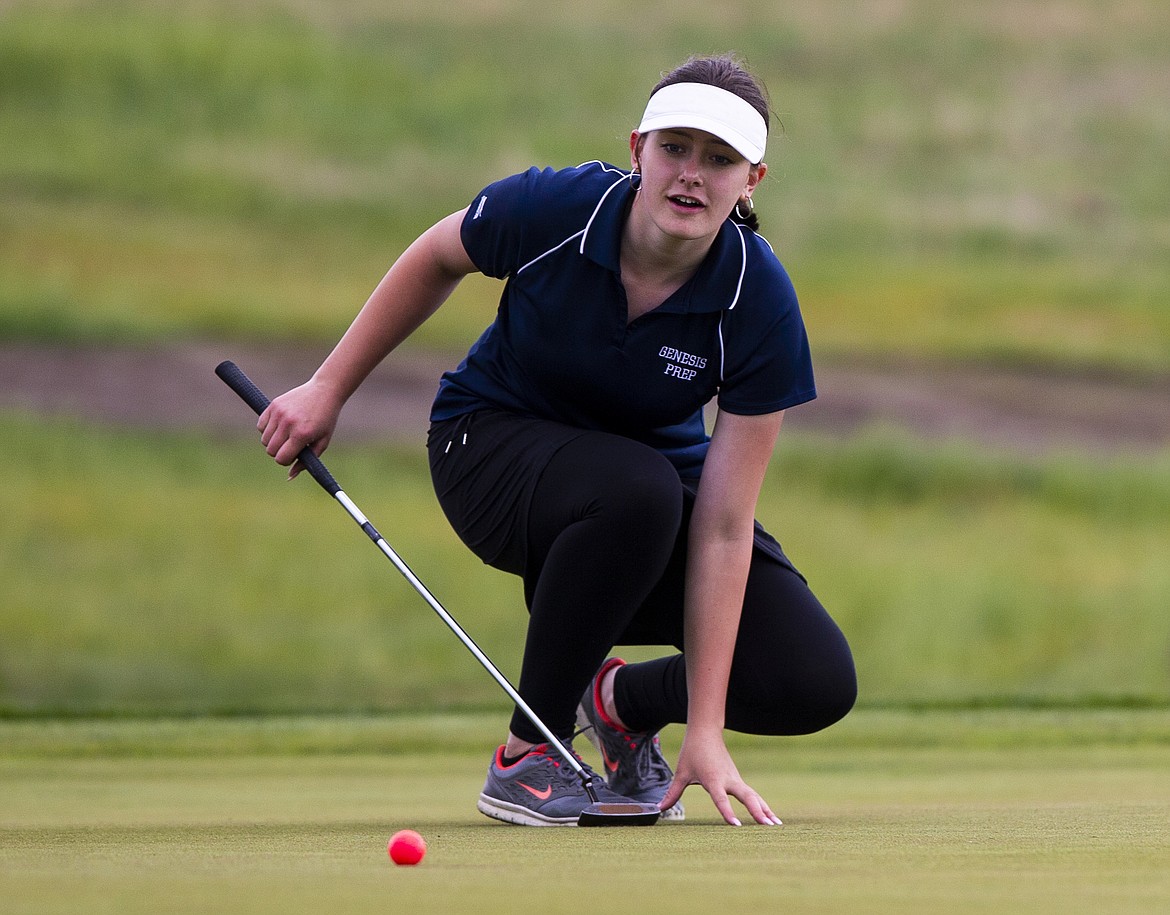 Josie Scribner of Genesis Prep eyes her putt on the first green Monday at the 2A District 1 tourney.