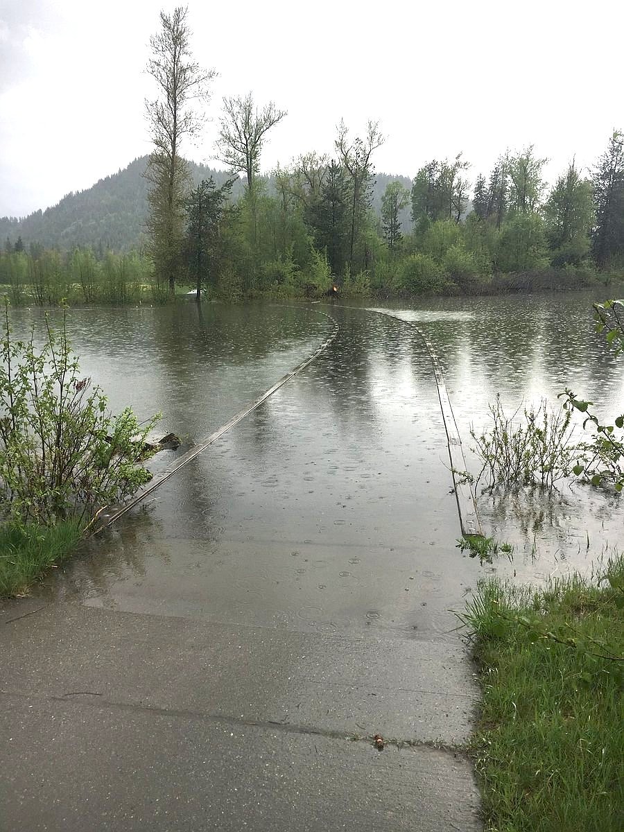 Photo by KRIS KNOWLES
Due to flooding, including this cart path over the Pack River, the Idaho Club will not be able to host the state 4A golf tournament today and Tuesday, and the tournament will instead be played at StoneRidge Golf Course. Heavy runoff and recent rains have flooded portions of the course from holes No. 14-18, rendering the course unplayable for now, with levels potentially rising in the next few days. &#147;You could see the water creeping up onto the green ... so we had to move the tournament,&#148; Sandpoint athletic director Kris Knowles said, lauding StoneRidge for stepping up to host on short notice. &#147;They were awesome. They&#146;re taking us in and really saving our bacon.&#148;