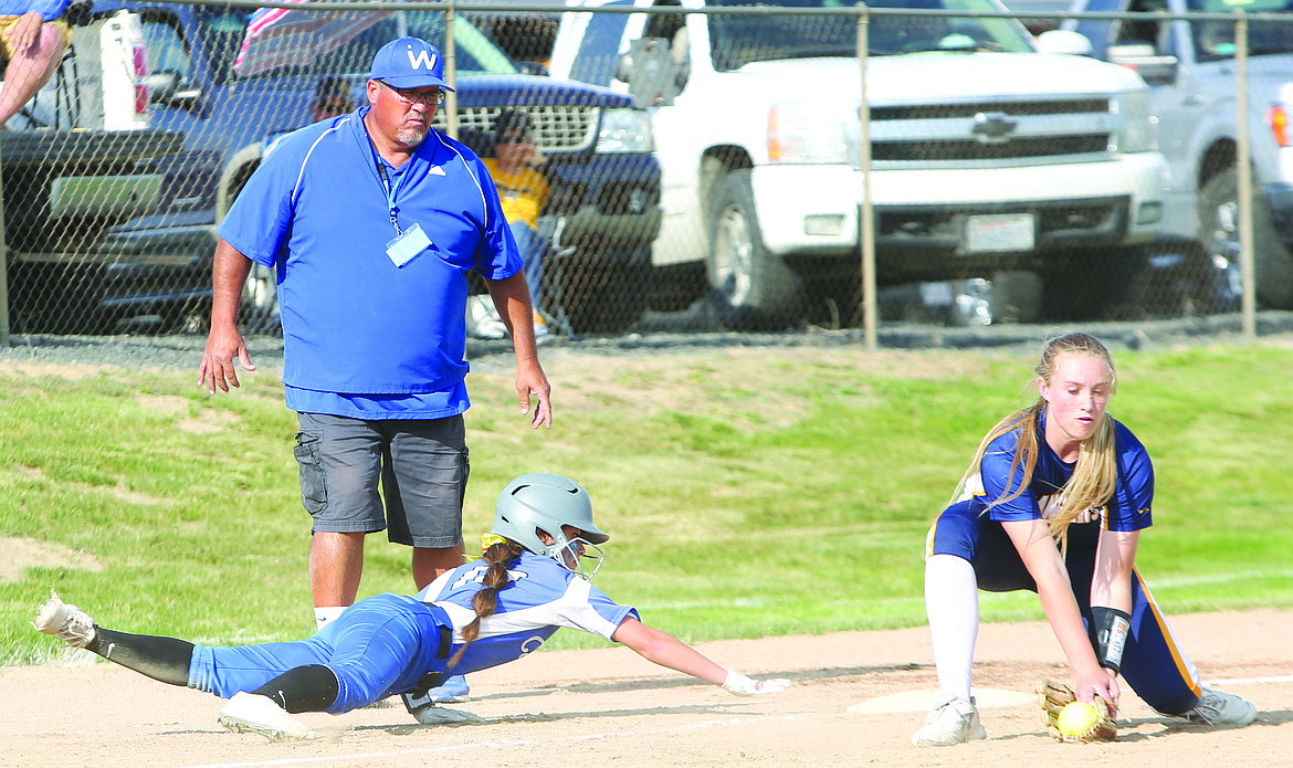 Connor Vanderweyst/Columbia Basin Herald
Warden's Ashlyn Yamane dives back to reach third base safely.