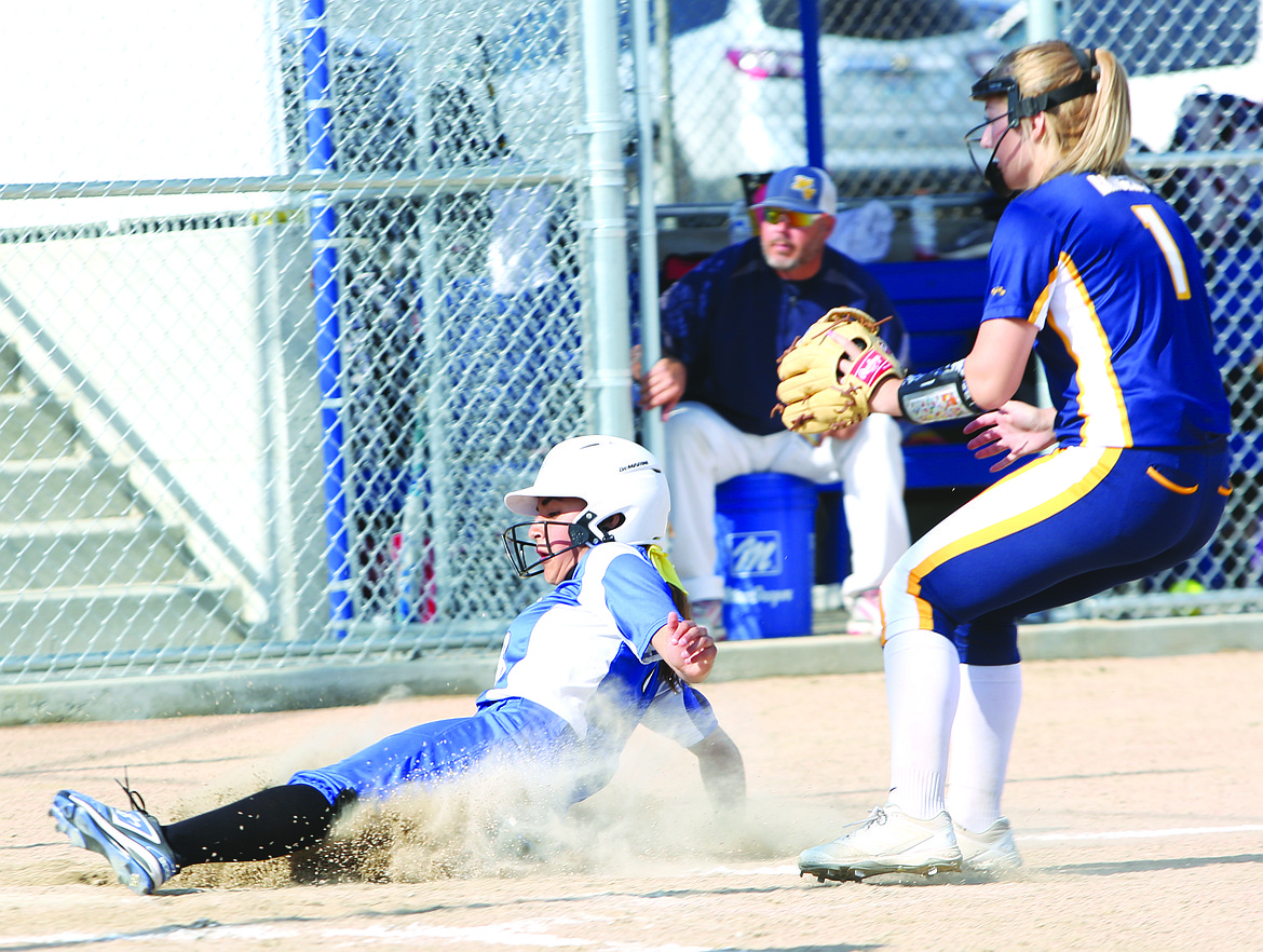 Connor Vanderweyst/Columbia Basin Herald
Warden's Alexia Hernandez slides into home plate and scores against Naches Valley.