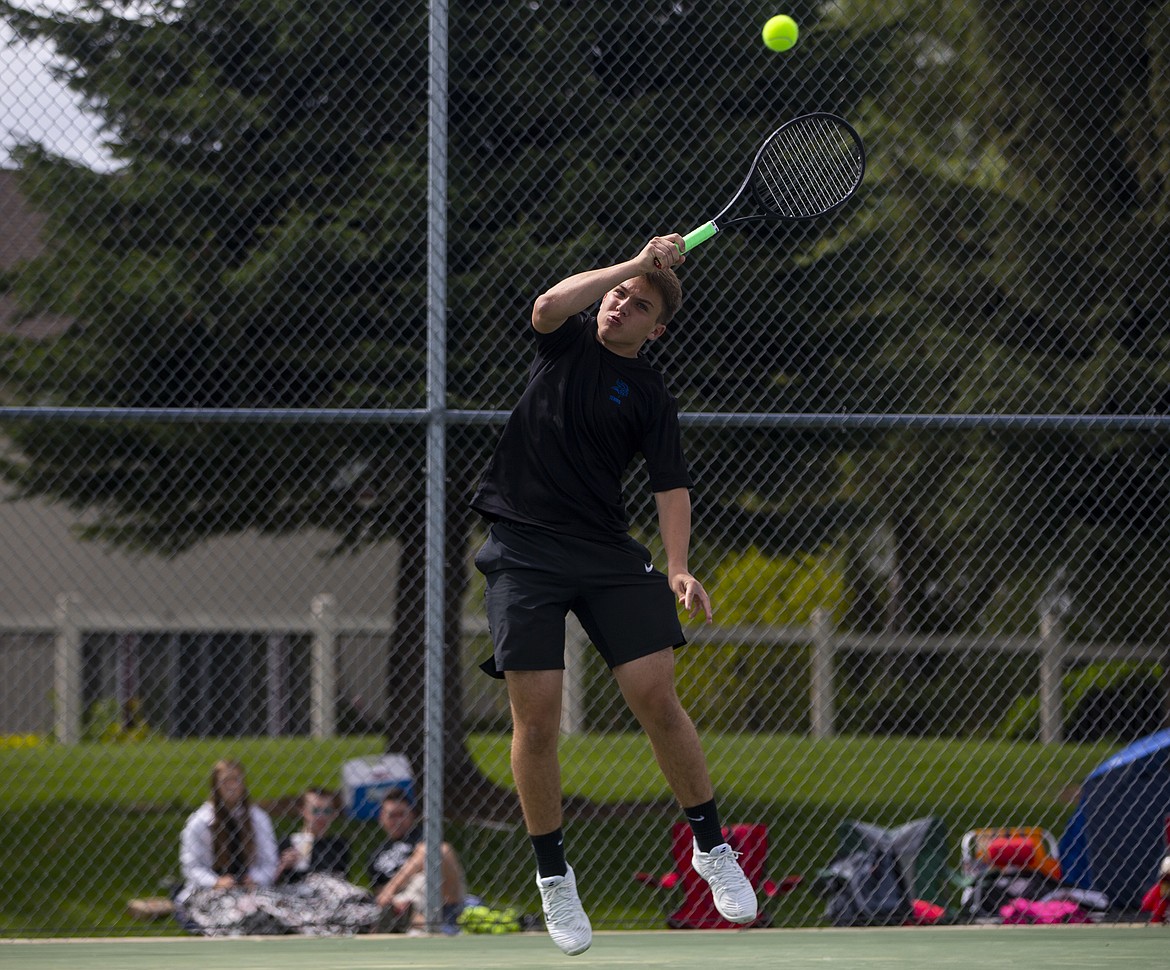 Bracken Curtis of Coeur d&#146;Alene High hits a high return in a boys doubles match vs. Post Falls at the 5A Region 1 tournament at Lake City High. 

LOREN BENOIT/Press