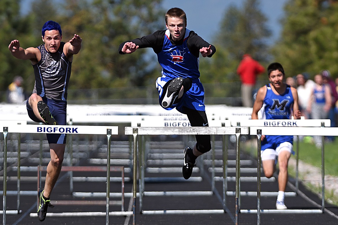 Bigfork's Wyatt Duke takes first in the boys 110 meter hurdles at the Bigfork Invitational track and field meet on Saturday. (Casey Kreider/Daily Inter Lake)