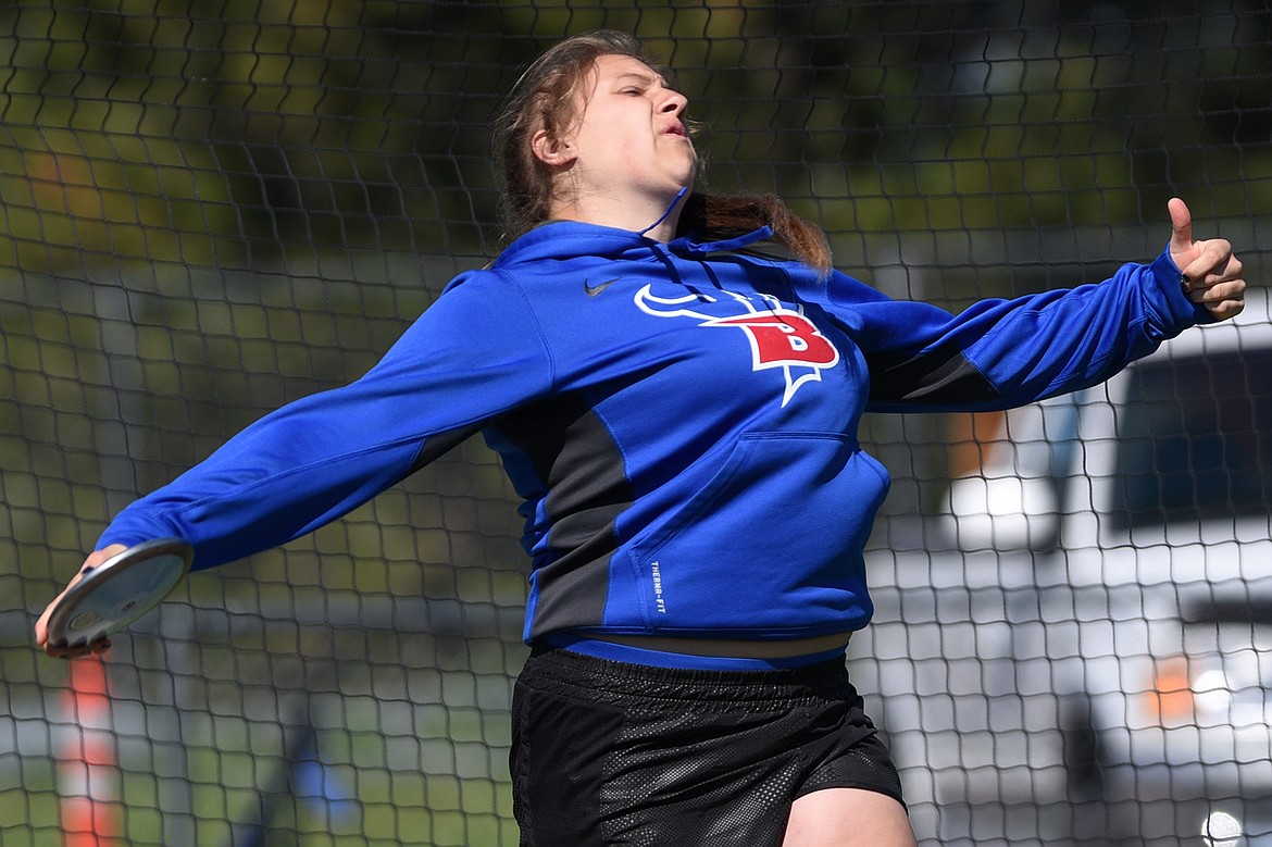 Bigfork's Ashton McAnally competes in the girls discus at the Bigfork Invitational track and field meet on Saturday. (Casey Kreider/Daily Inter Lake)