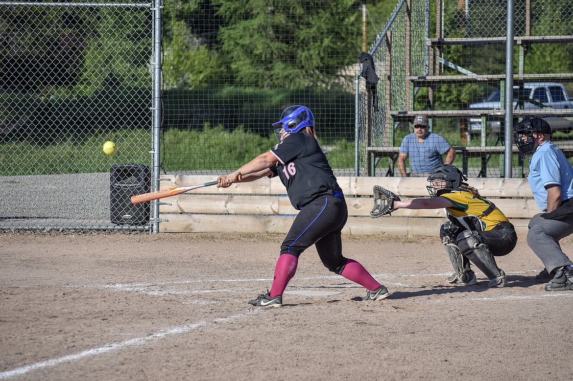 Libby junior Bridgett Haskins gets a single off a pop fly, bringing freshman Bethany Thomas home for the final run of the Lady Loggers' 11-0 win over Whitefish, Monday, May 14.